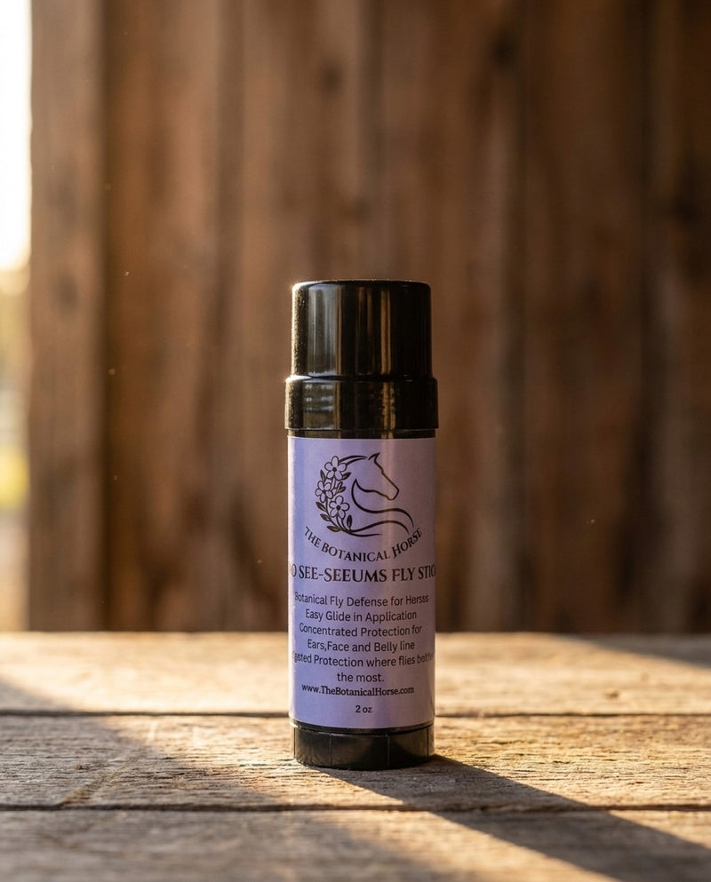 The Botanical Horse No-See-Um Fly Stick 2 oz glide-on fly defense on rustic barn wood